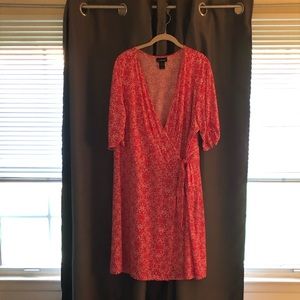 Pink wrap dress with small white dot pattern